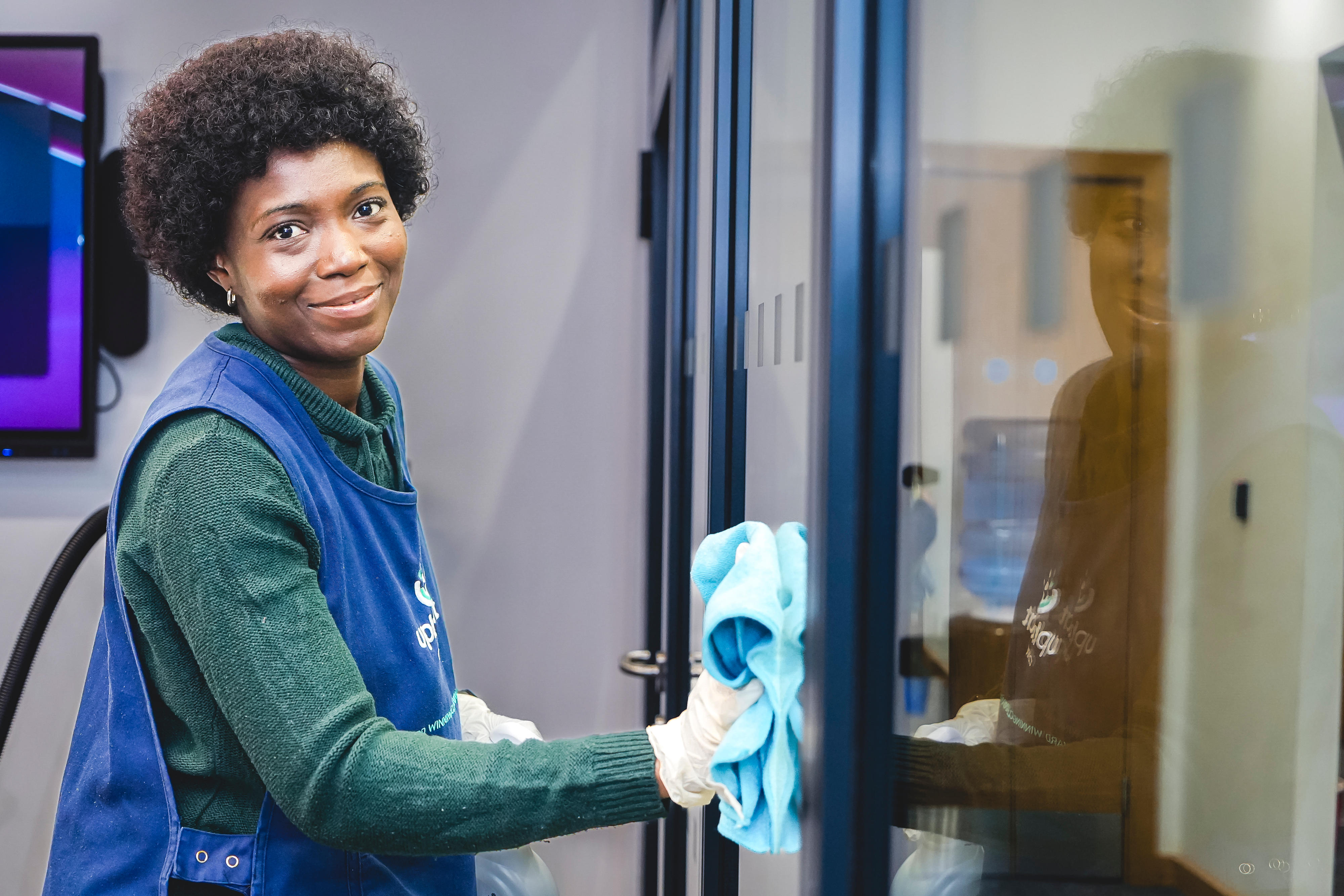 Woman cleaning an office